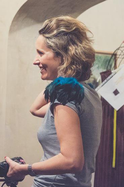 Shoulder pads with turquoise feathers